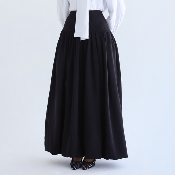 Black flowing pleated skirt