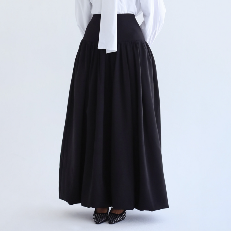 Black flowing pleated skirt