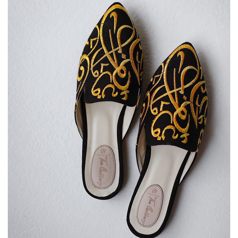 Black embroidered pointed toe slippers