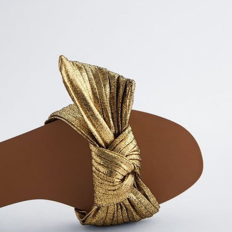 Gold bow leather slippers