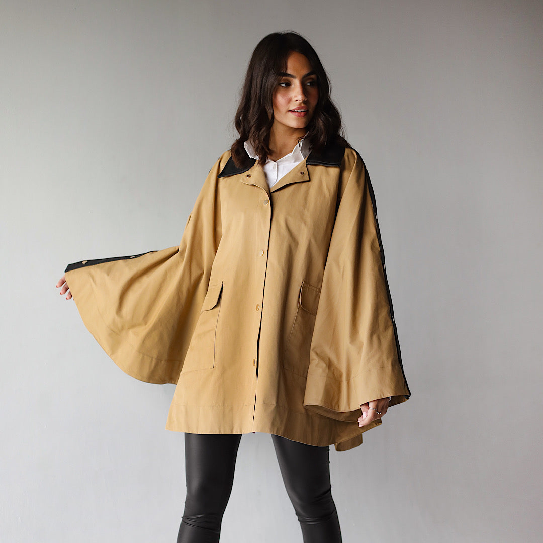 Beige buttoned poncho – The Gallery