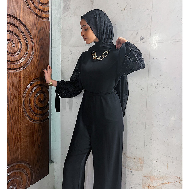 Black jumpsuit with glittery sleeves