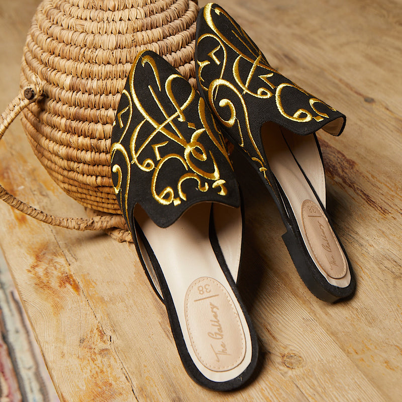 Black embroidered pointed toe slippers